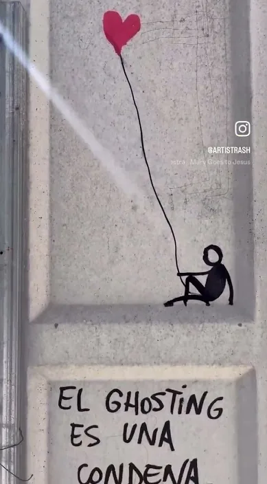 Small figure with a red heart balloon and a painted line on a grey box in the street, Barcelona, Art Is Trash