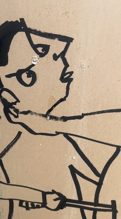 Dibujo de una figura con línea negra sobre un trozo de cartón, Barcelona – Art Is Trash