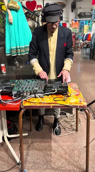 Art installation inside the HolaIbiza shop with a DJ playing, Barcelona, Art Is Trash
